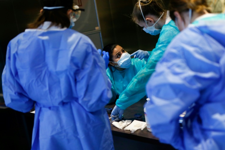 Healthcare workers ready for the arrival of COVID-19 patients at a five-star hotel in Barcelona