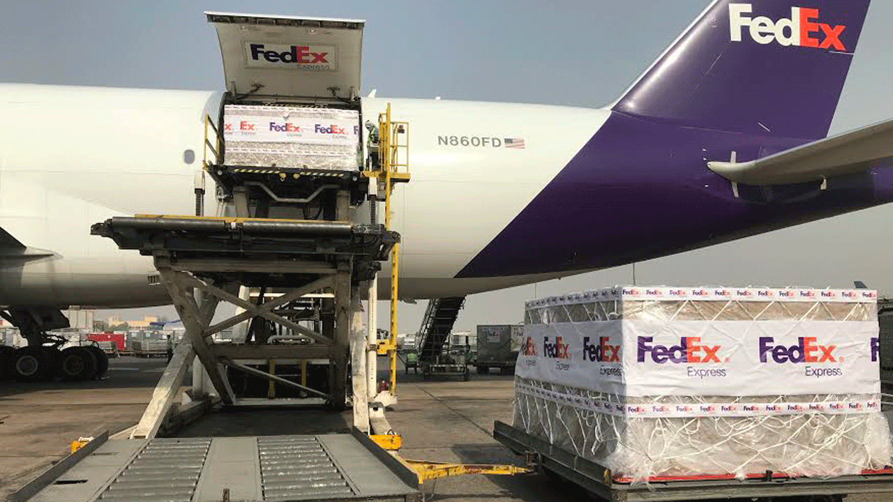 Oxygen concentrators are unloaded from the plane at Indira Gandhi International Airport, Delhi, India (photo source: FedEx