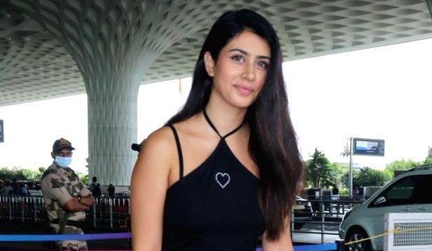 Warina Hussain gets spotted at the airport wearing a sassy black halter-neck one-piece!