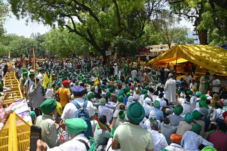 Farmers gather at the site of an ongoing protest by Indian wrestlers in New Delhi on May 8, 2023