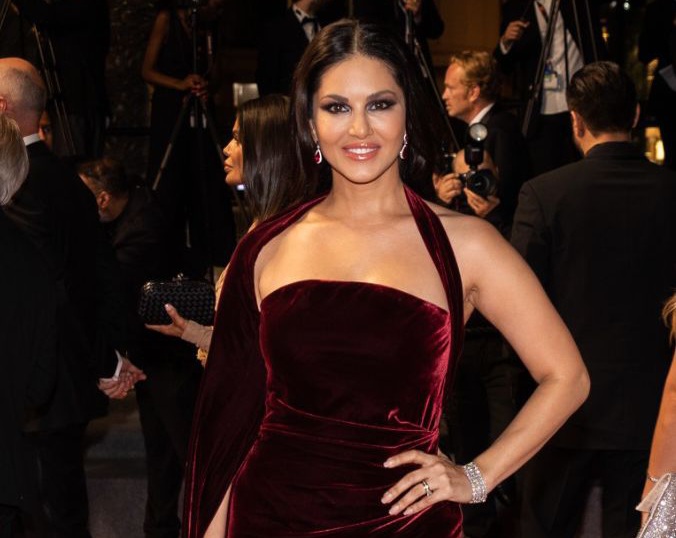 In wine red velvet dress, Sunny Leone looks mesmerising, turns heads at the Cannes Red Carpet!