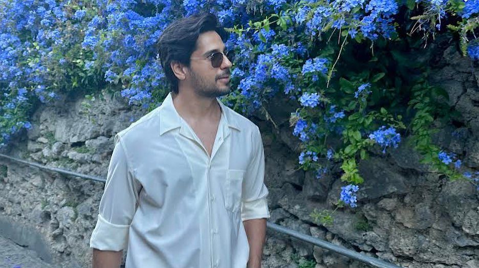 Sidharth Malhotra strolls amongst the blue bougainvillea in Italy!